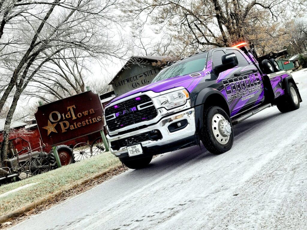 tow truck recovery service in Palestine TX pulling vehicle on steep incline
