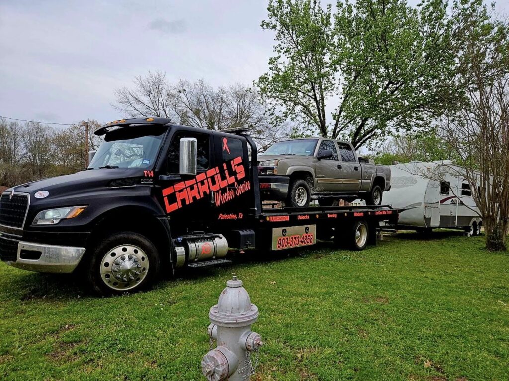 flatbed towing service in Palestine TX transporting pickup truck