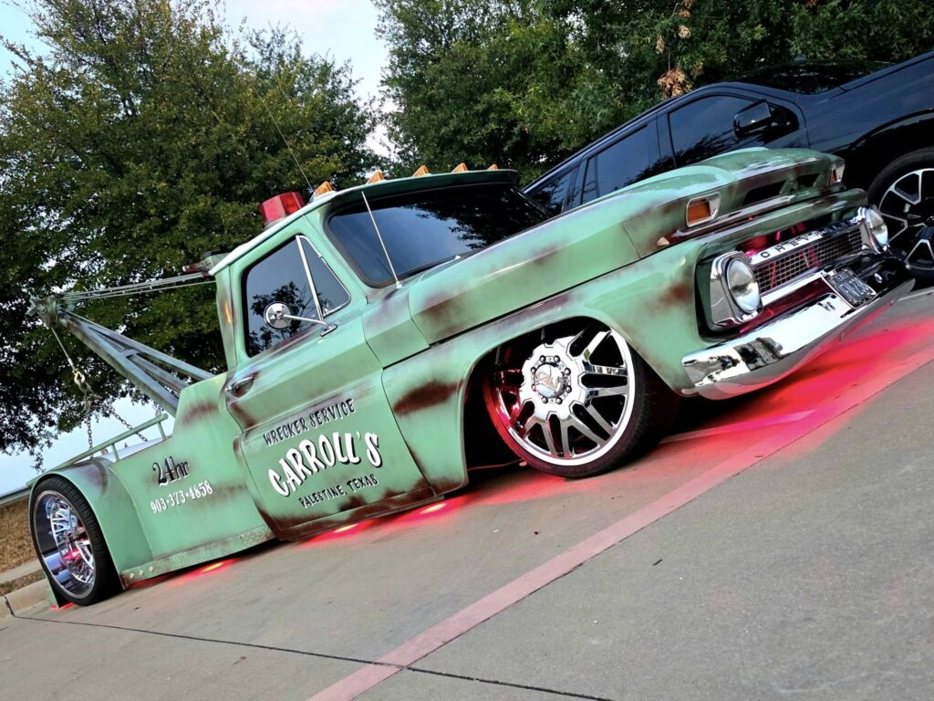 vehicle towing service in Palestine TX loading custom pickup truck